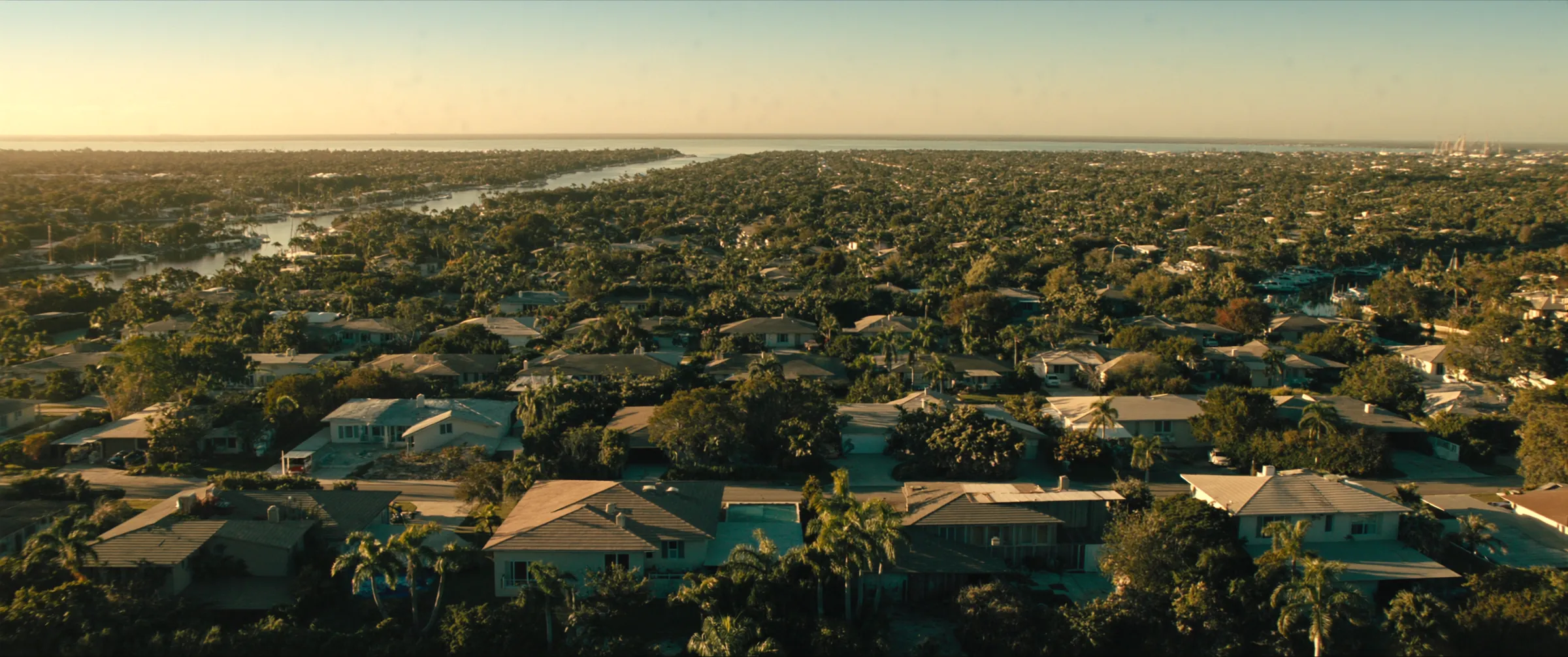 Aerial view of a South Florida residential neighborhood at golden hour